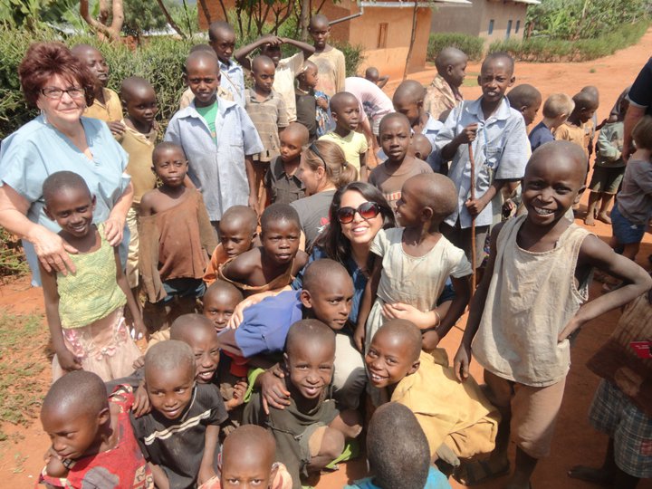 A picture of Suzette Munson ministering to Rwandan children.